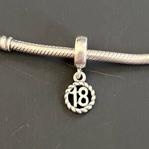 Silver Pandora bracelet charm with number 18